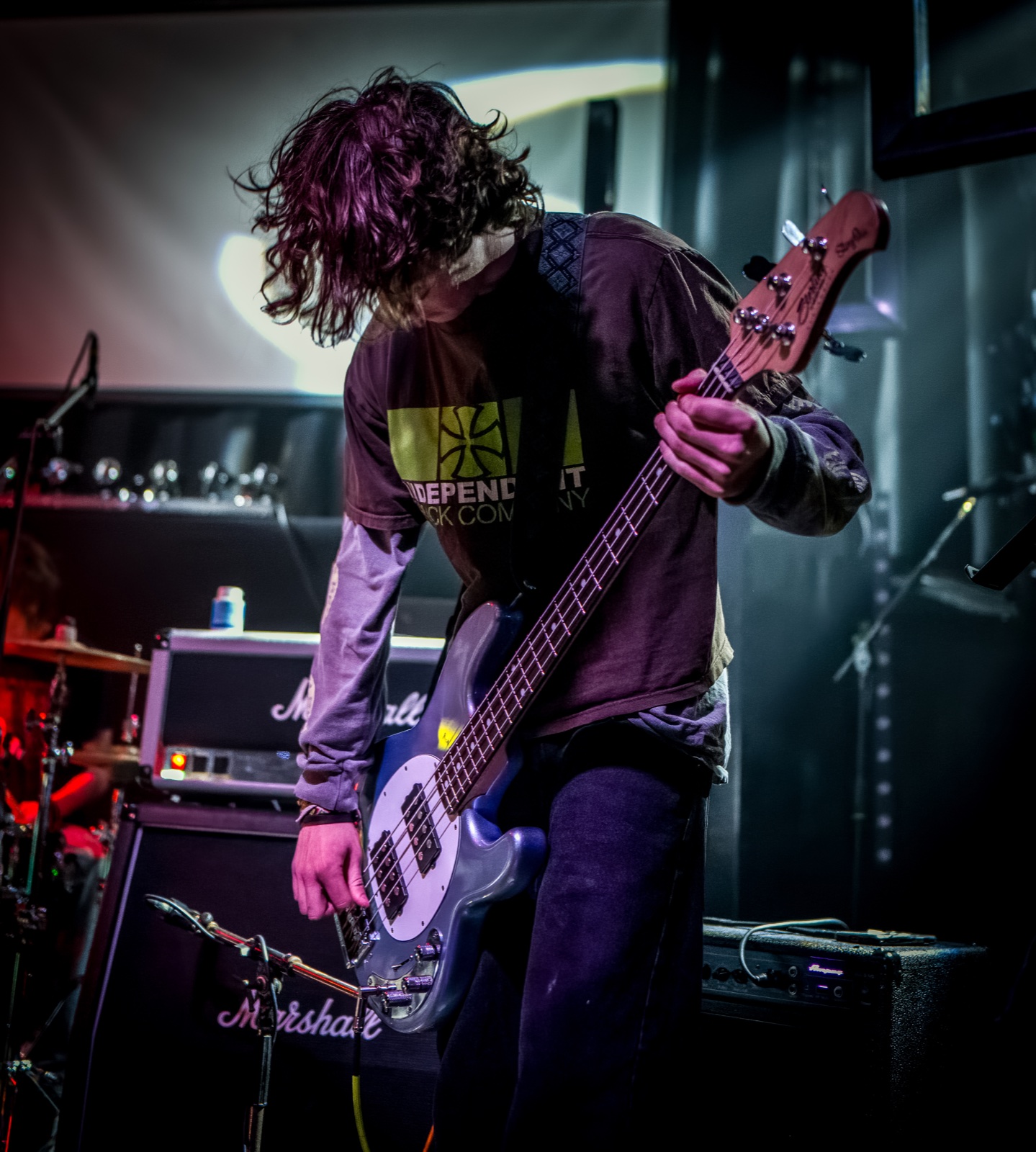 An Aphid bassist performing at The Brickyard
